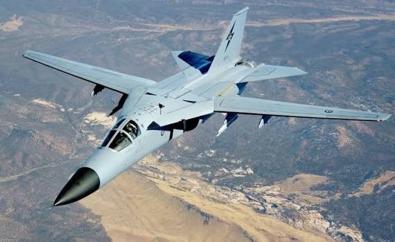 RAAF F-111 in flight over terrain