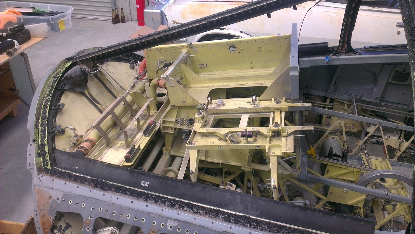 Cockpit stripped to frames and mounting structures in preparation for careful reassembly