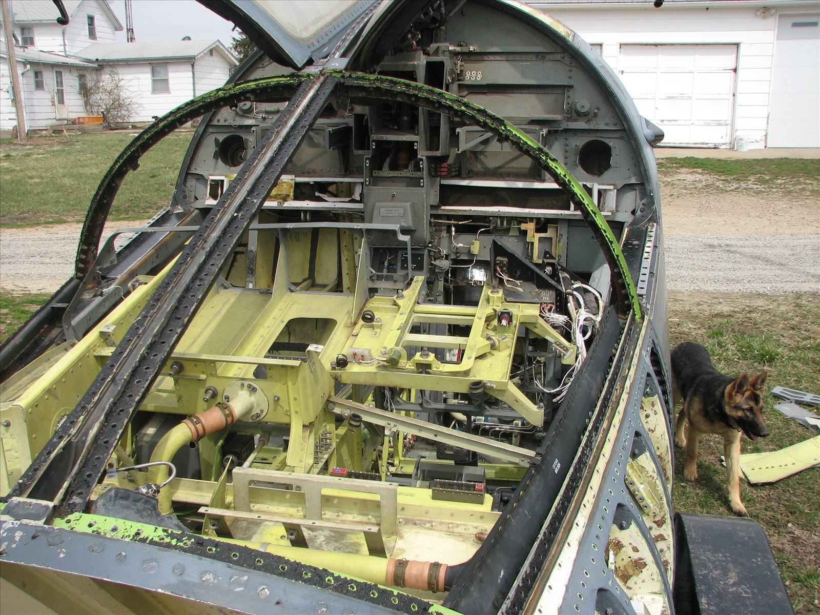 Surviving crew module on a trailer before restoration, canopy closed, exterior weathered
