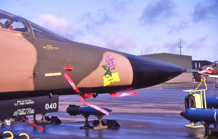 Close view of 68-0040 nose art, aircraft number and crew-name panel