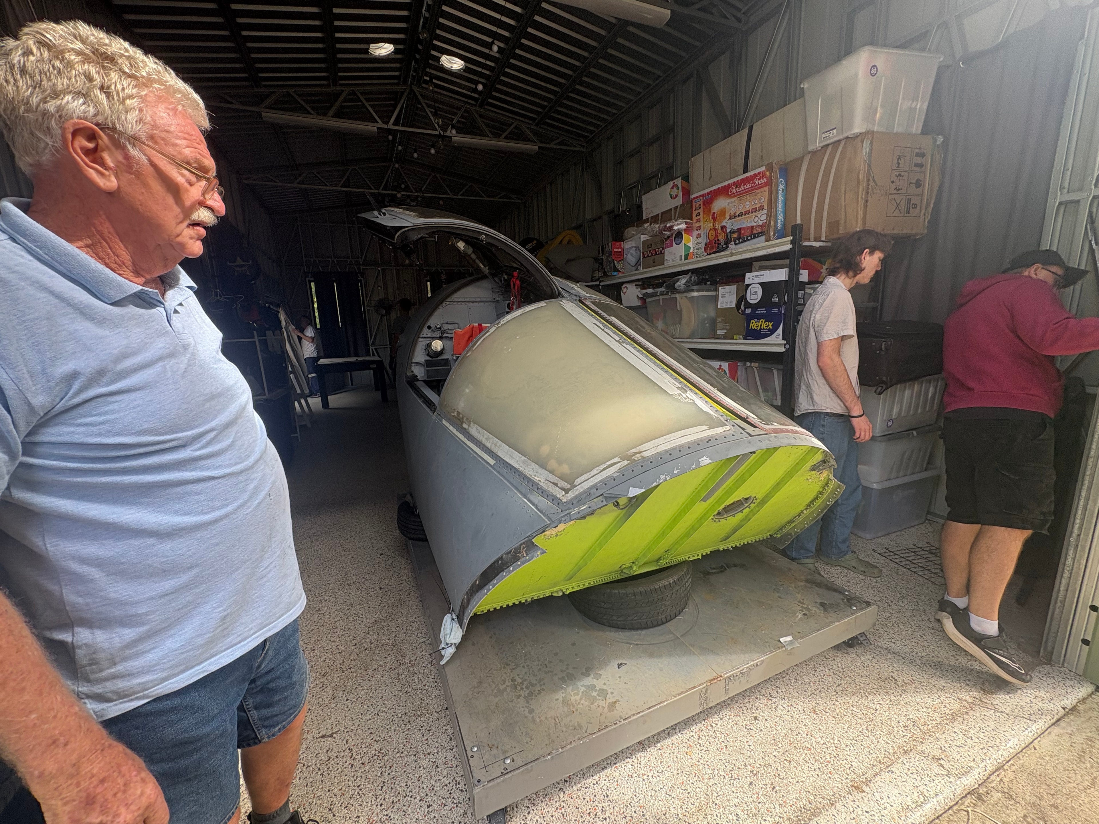 Crew inspecting F-111 module after arrival in Brisbane