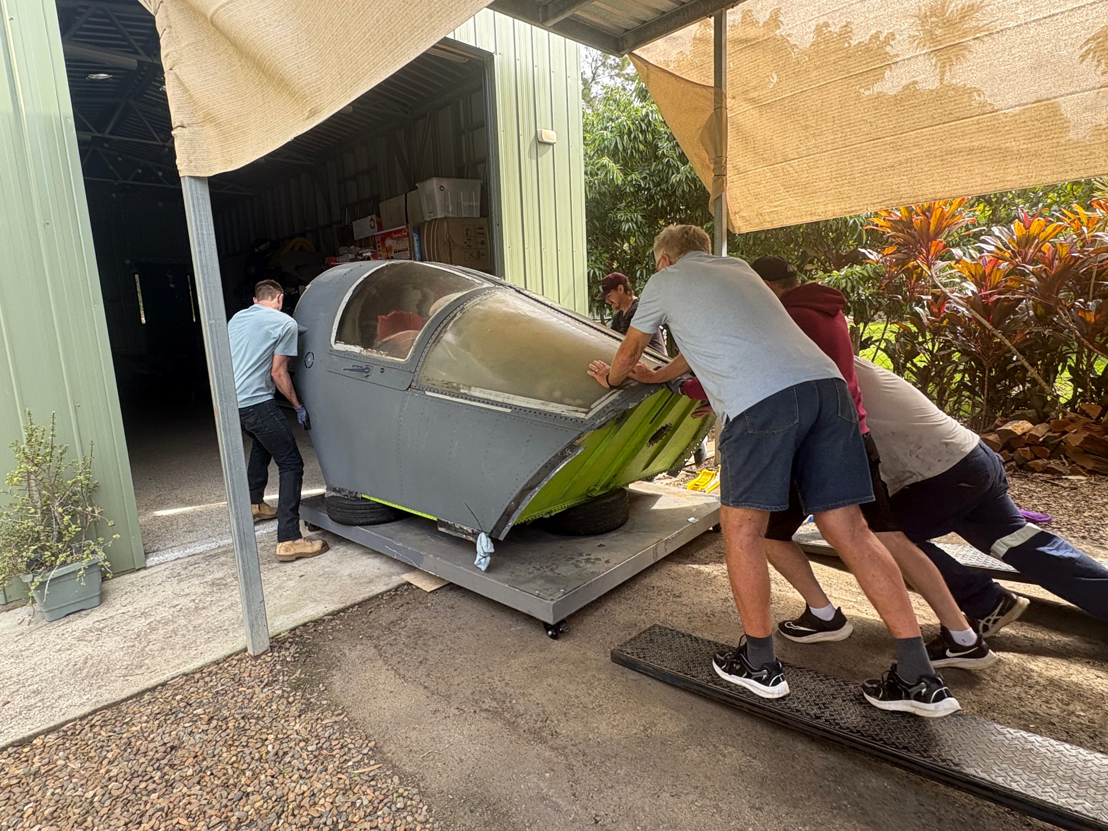 F-111 crew module being pushed into Brisbane workshop